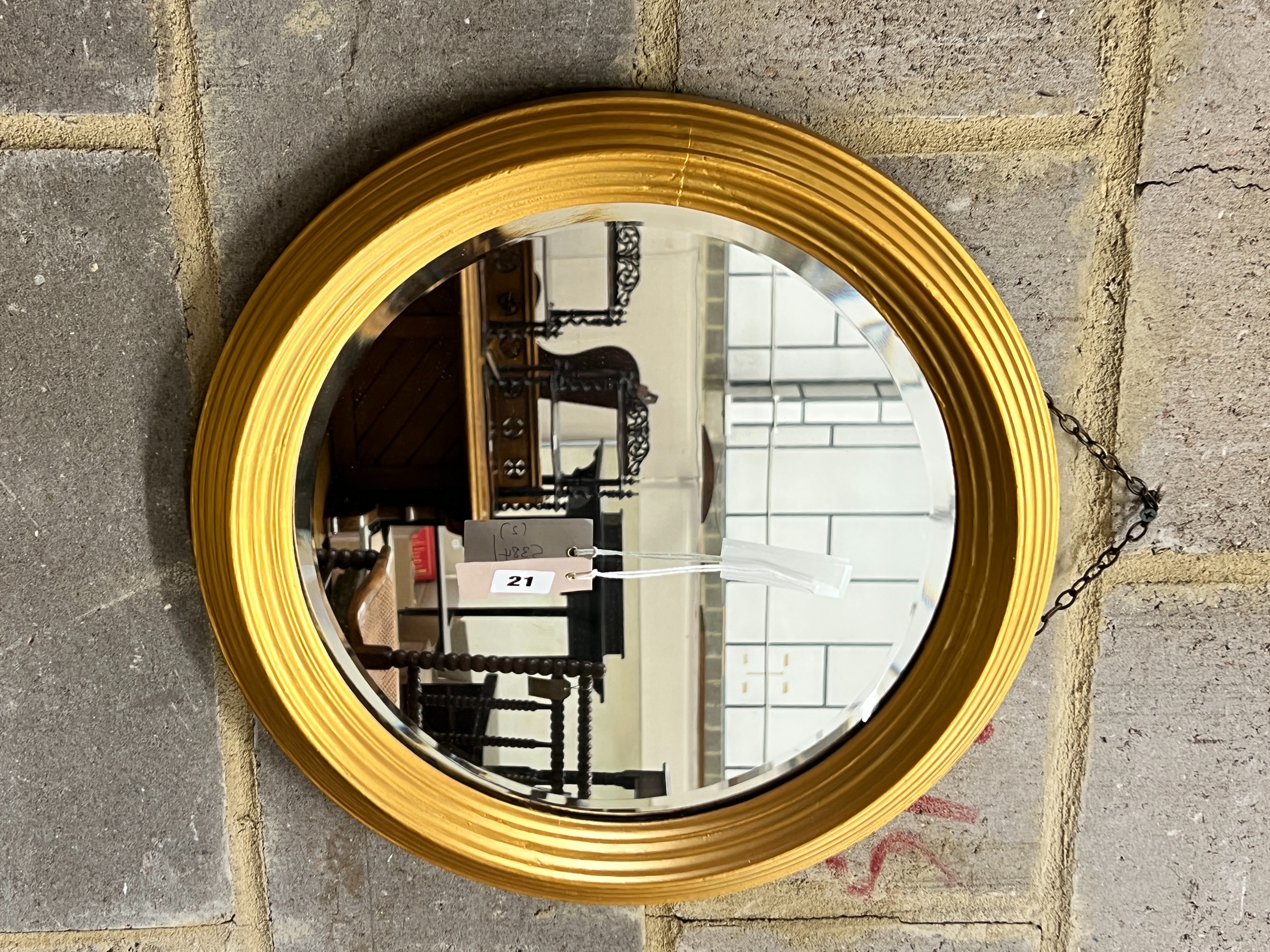 A 19th century style French embossed metal wall mirror, width 43cm, height 72cm together with a circular gilt framed wall mirror